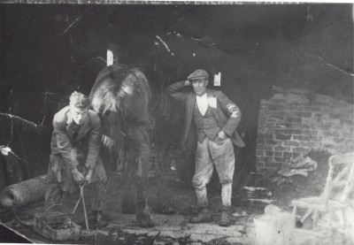 Douglas Male blacksmith & Will Best shoeing horse