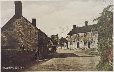 Colour postcard looking west past Wyndham Arms, Gummers Cottage on left.