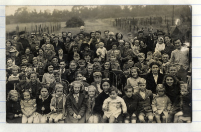 Large group photo of children with some adults