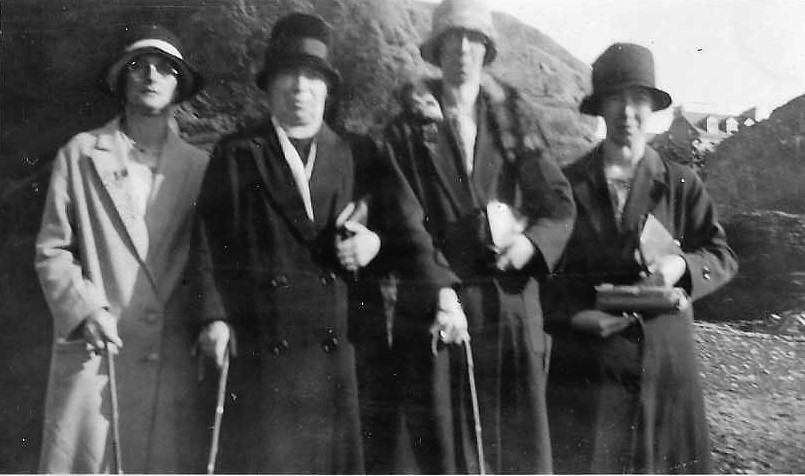 Four women in hats & coats.