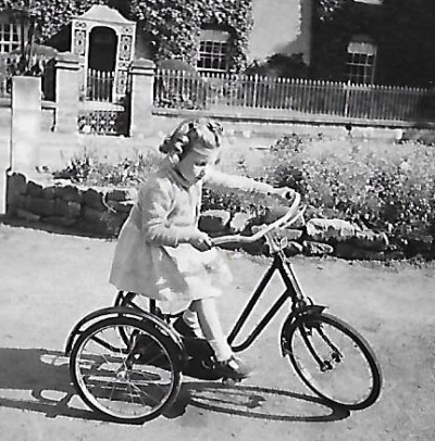 Girl on tricycle