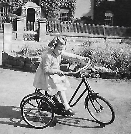 Girl on tricycle