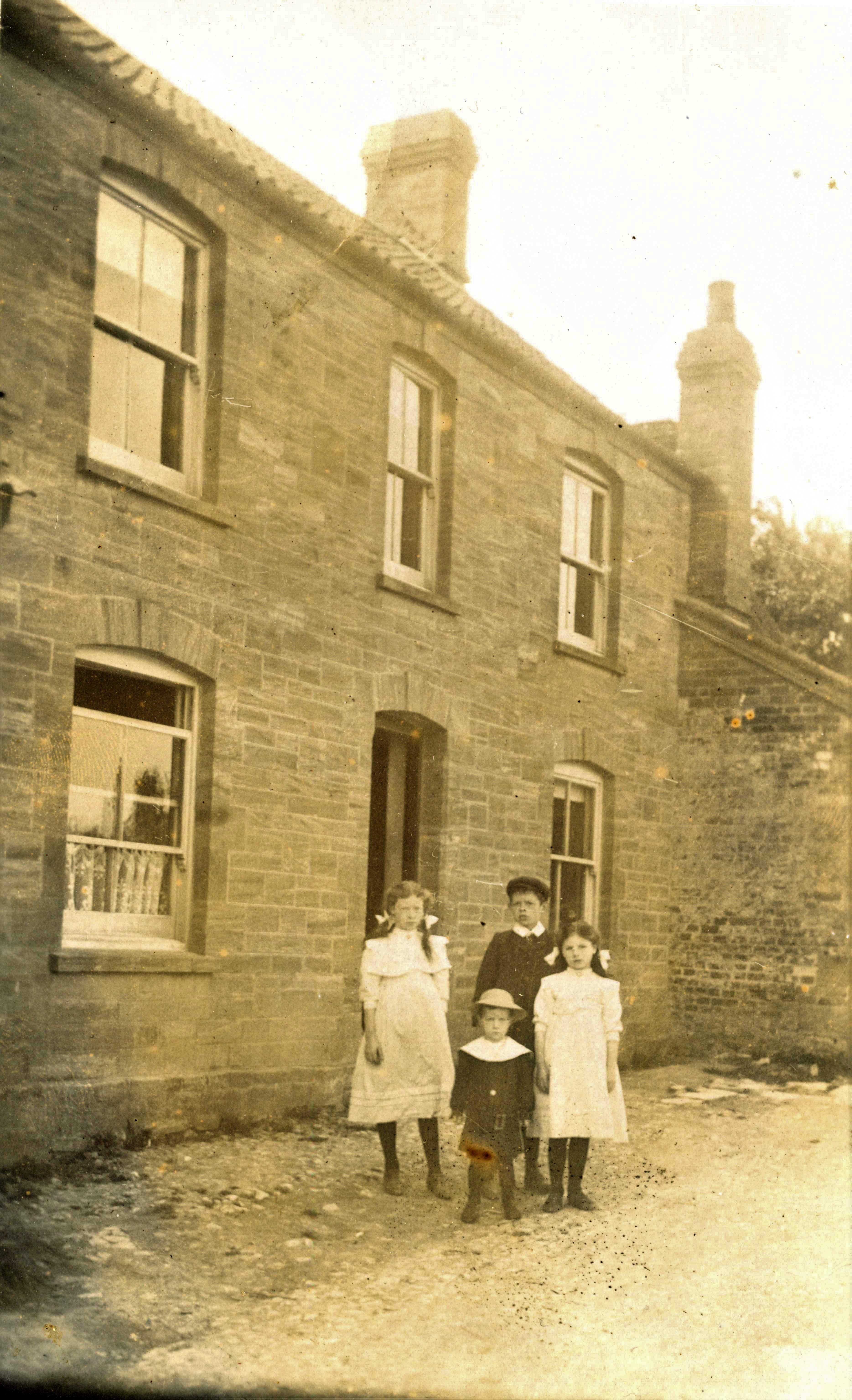 Children - outside house with sash windows