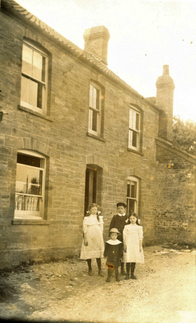 Children - outside house with sash windows