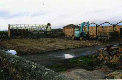 Demolition of farm buildings, masonry  walls, and floor slabs.