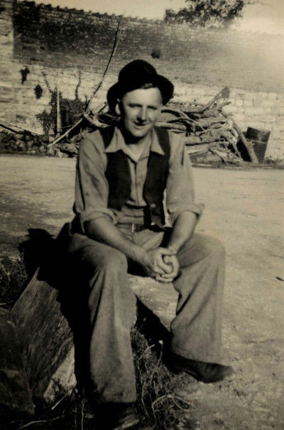 Man sitting in the yard at Coxs Farm