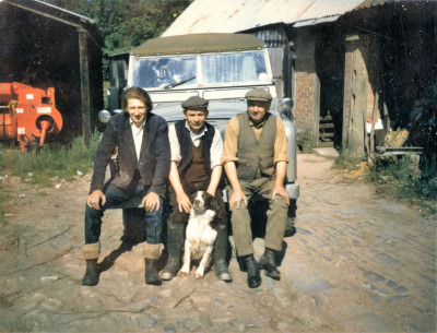 Lock family members with dog and Land Rover