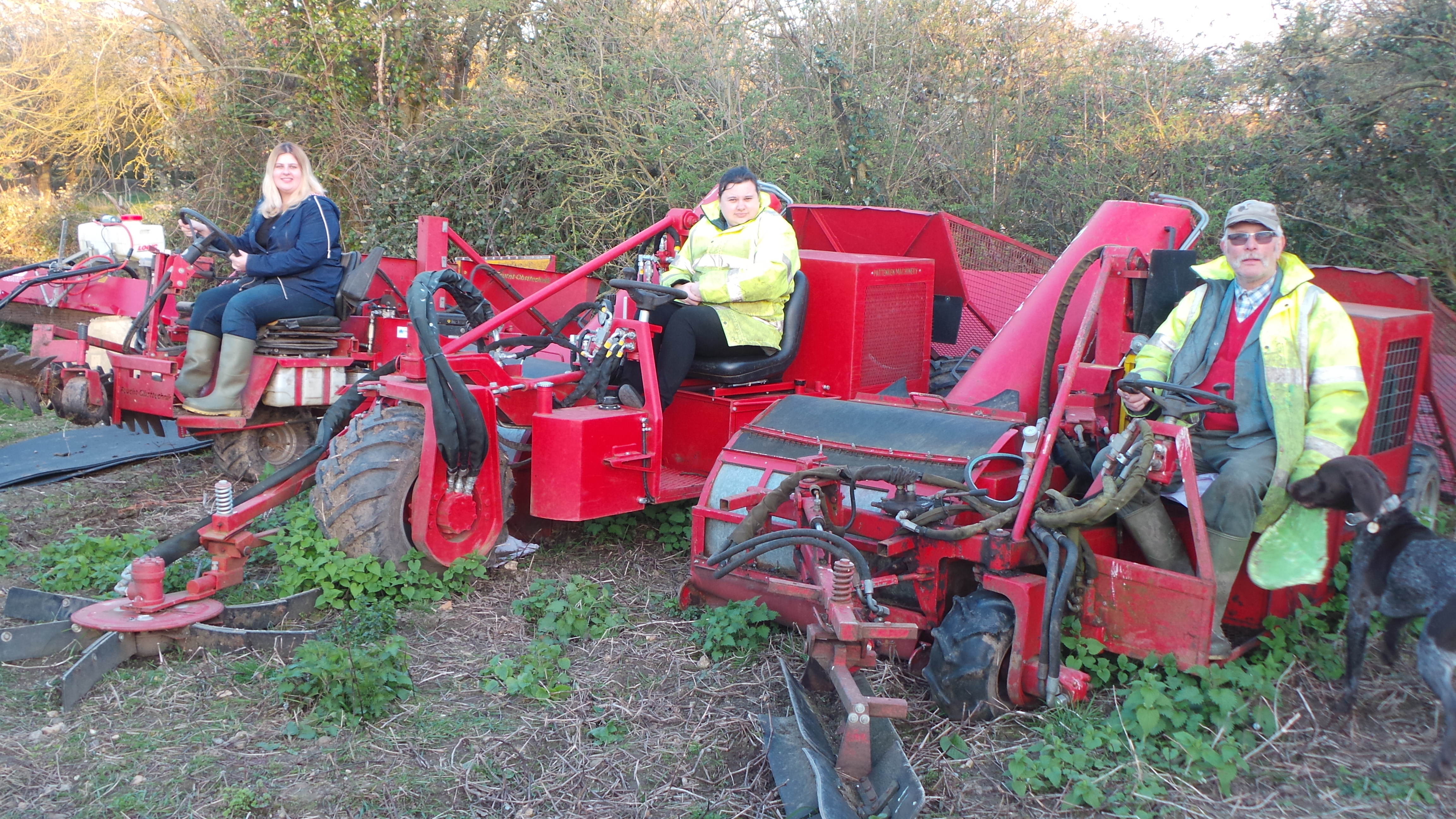 Paul Lock with daughters behind farm machinery