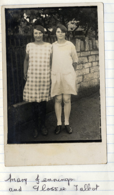 Two girls in front of railings