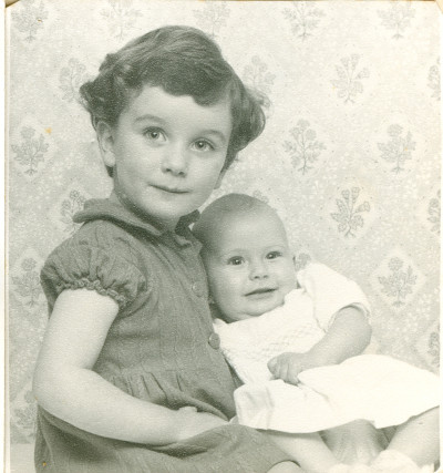 Child holding baby.