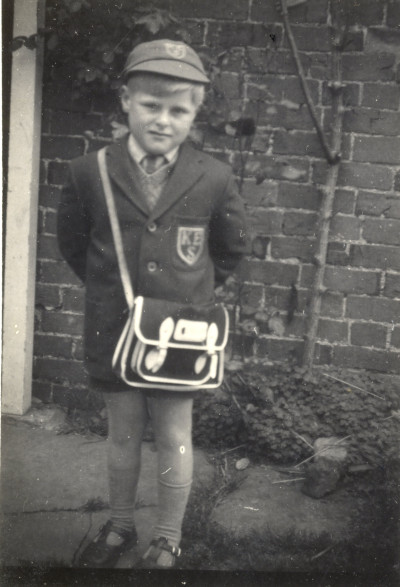 Child in School Uniform possibly Graham Bradford.