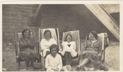 Women with child on beach.
