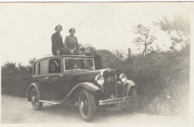 Three women and Austin car.