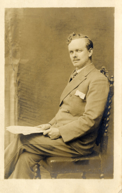 William James Heskins sitting on chair