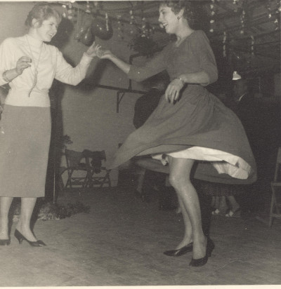 Two women dancing.