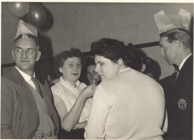 Group of men and women at glovers social event.