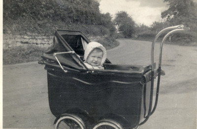 Child in pram in road