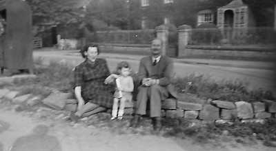 Couple outside of George Mounter's Garage