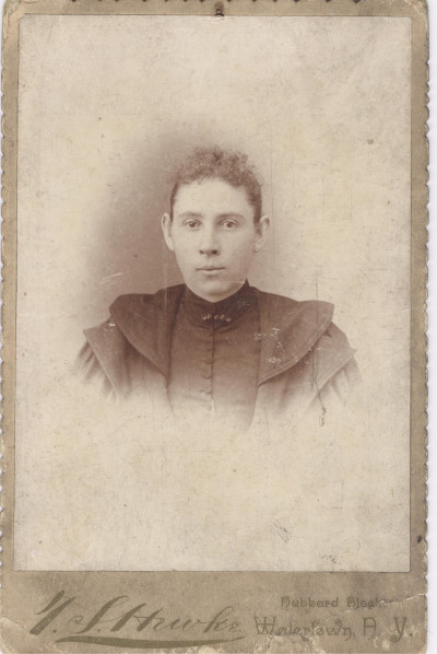 Young woman in I S Hawke Studio photograph, Watertown, New York.