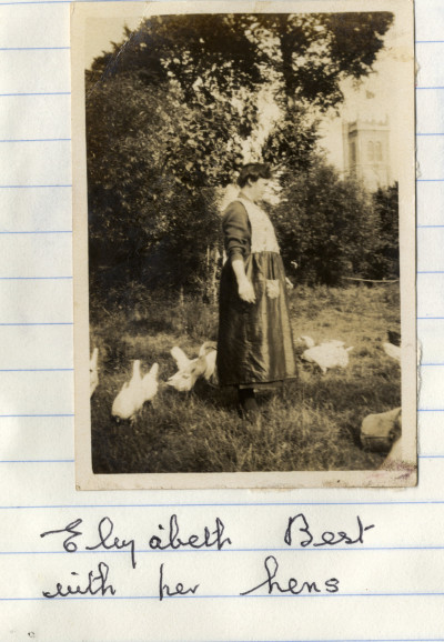 Woman with hens in field next to St Martin's Church