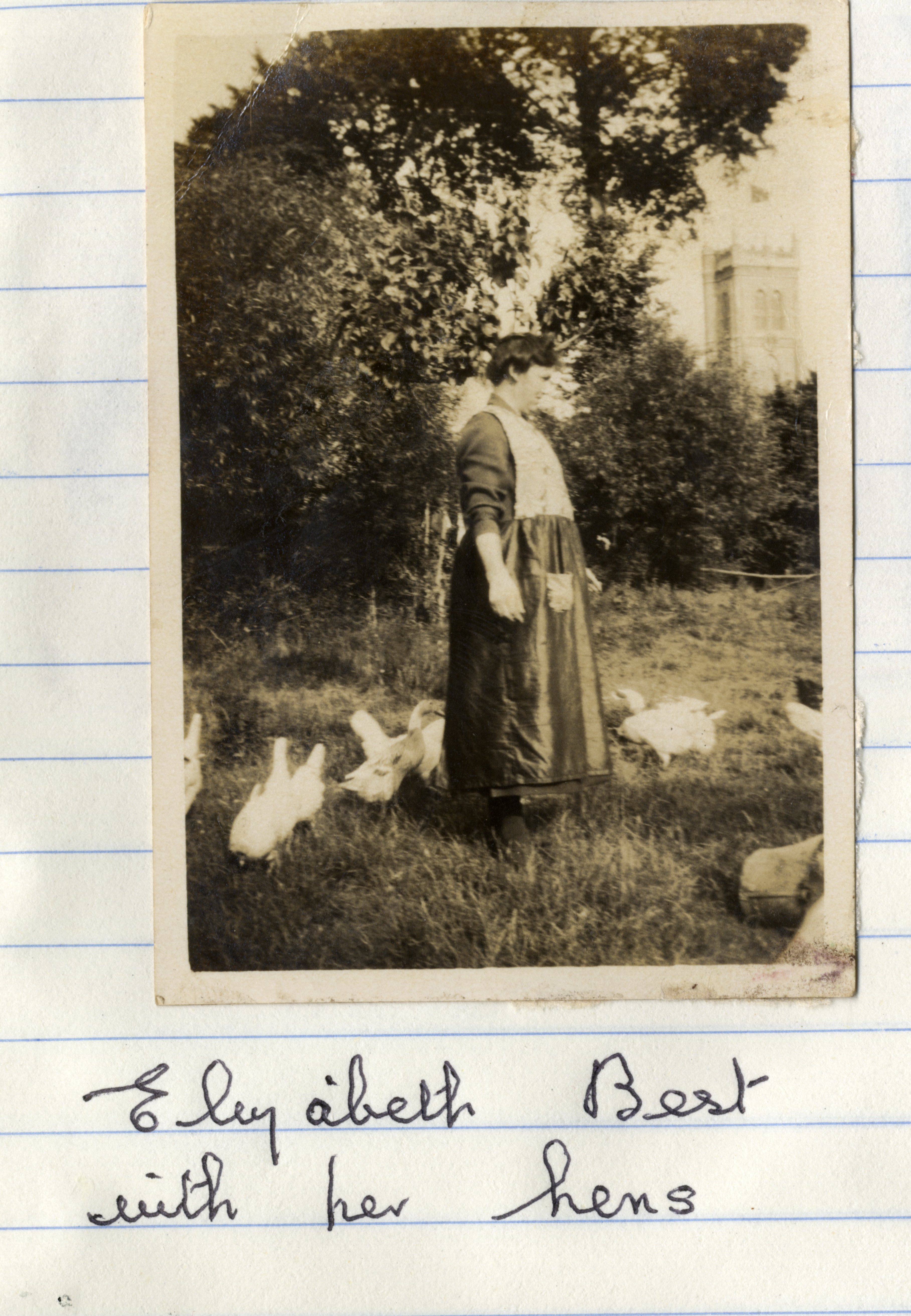 Woman with hens in field next to St Martin's Church