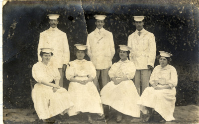 Nurse orderlies in white uniforms