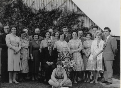 Group outside courrugated tin building/garage
