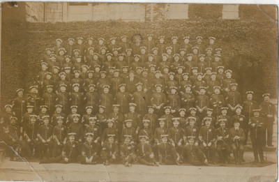 Large group of about 150 men in military uniform