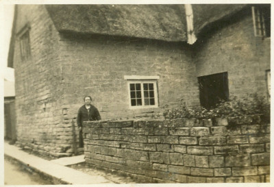 Stone Cottage, with thatch and front wall