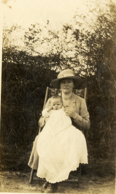 KC 698 Seated woman holding baby