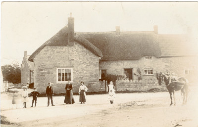 Postcard of Family Group and horse outside of Dudmoor Corner.