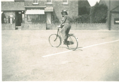 Kate Satherley on bicycle at top of Church Street
