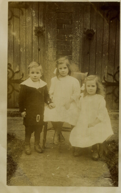 Bert, Phyllis and Dora Clark in front of Church Rooms.