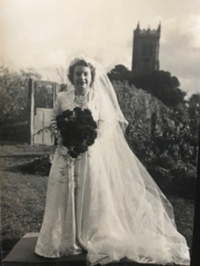Dorothy Welch - in her wedding dress in the garden of the New Inn