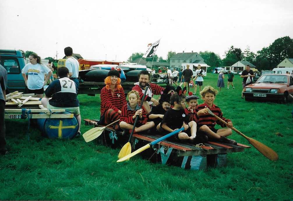 Photograph of children sitting on raft