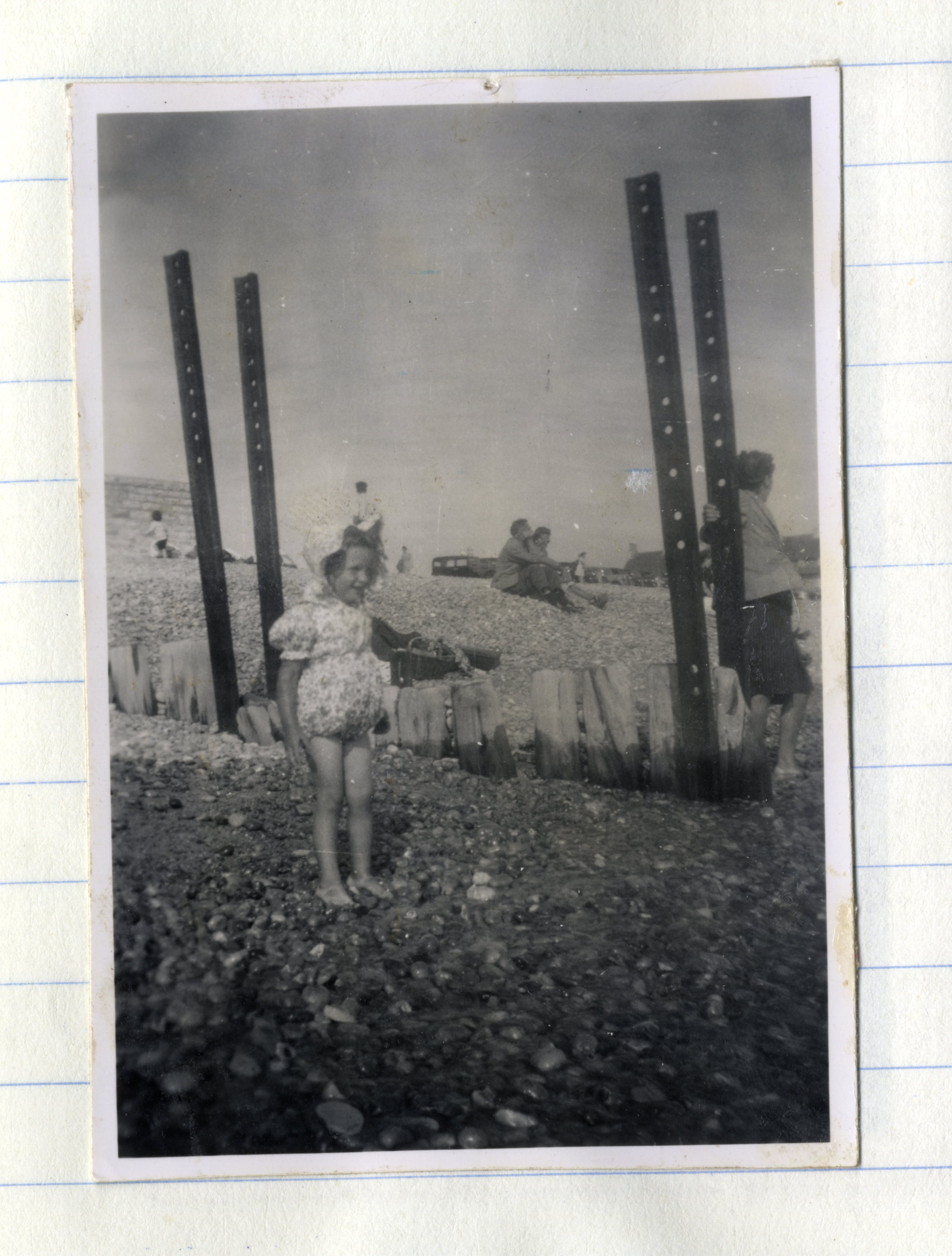 Child on pebble beach