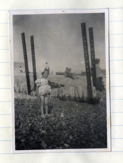 Child on pebble beach