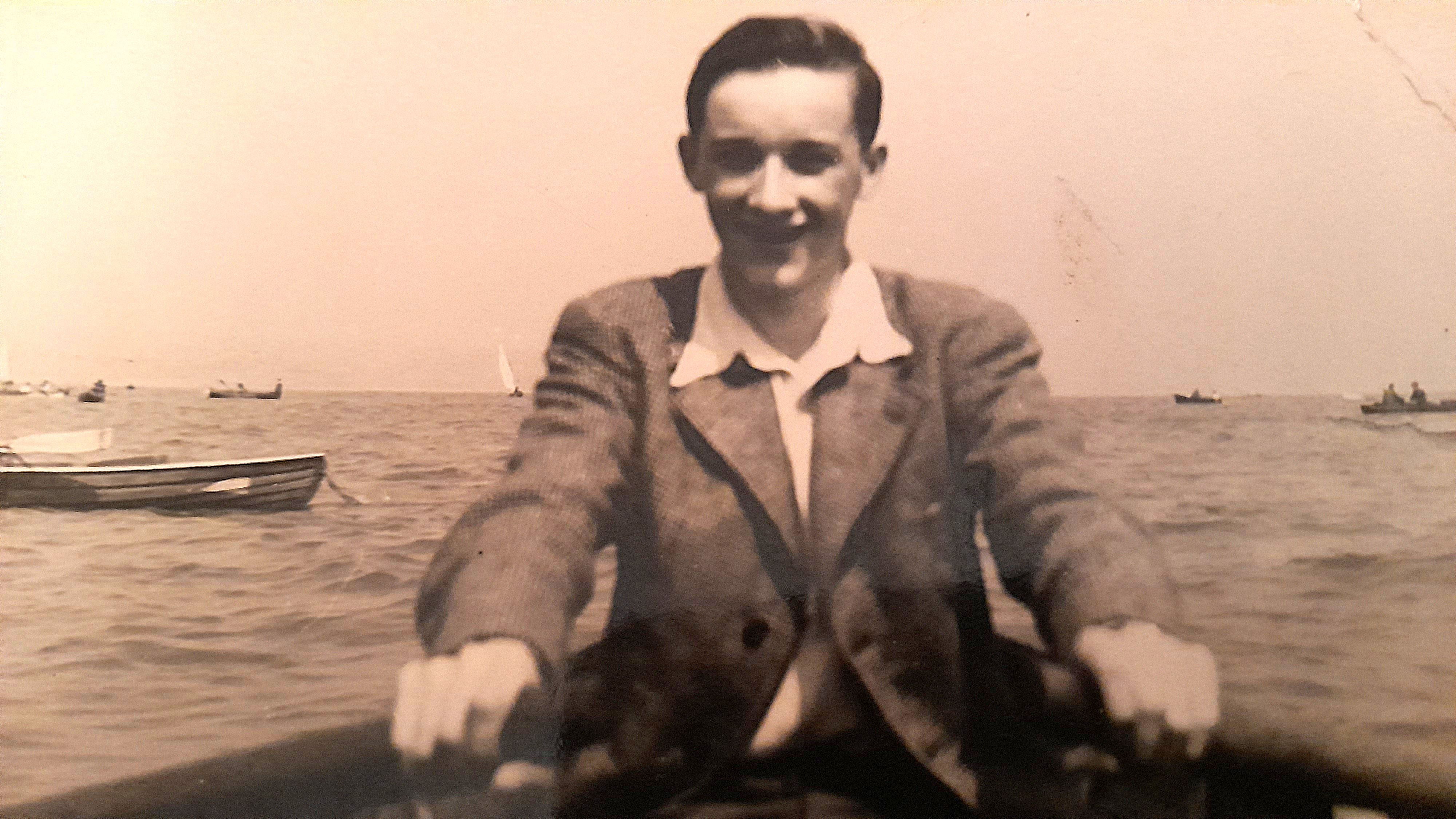 John Elliott in a rowing boat