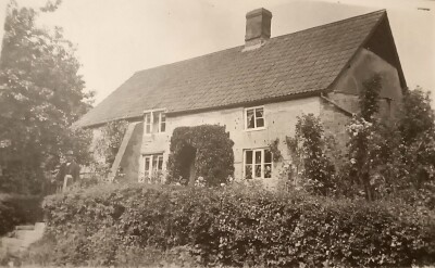 John Berriman outside cottage