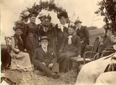 Group of older men and women sat in coal barge on the River Parrett at Thorney