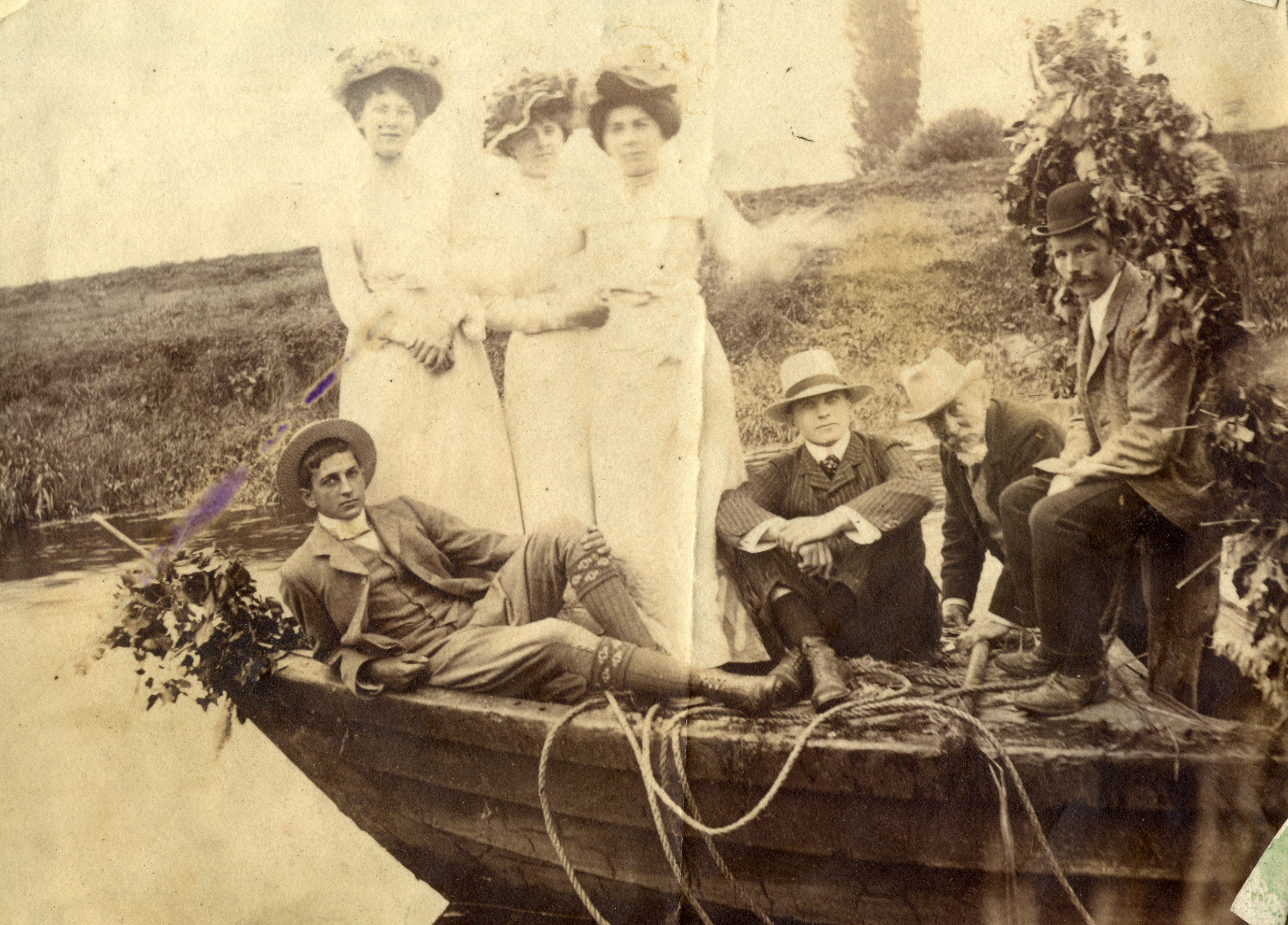 Group of well dressed men and women on prow of coal barge on River Parrett