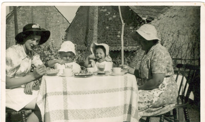 Family having tea outside