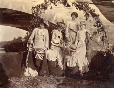 Group of six women in coal barge beneath Thorney Bridge