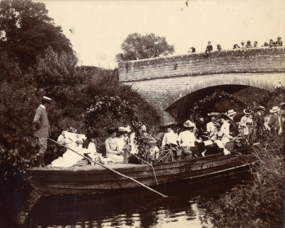 Coal barge party passing under Thorney Bridge