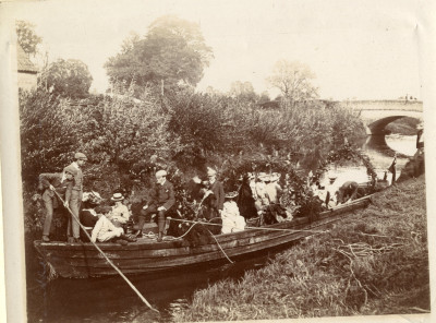 Decorated coal barge carrying group of people