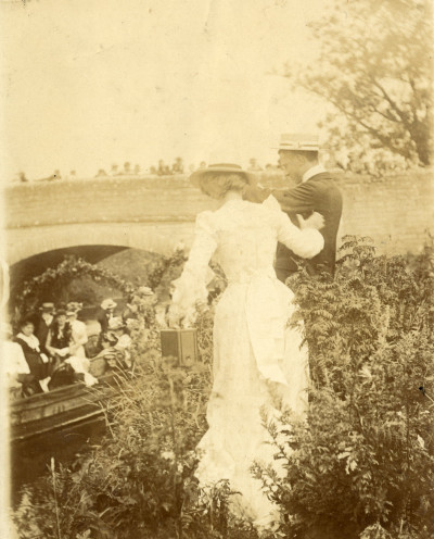Woman & man with box camera at Thorney Bridge