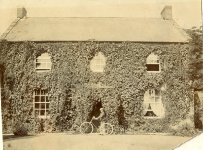 Thorney House and boy with bicycle