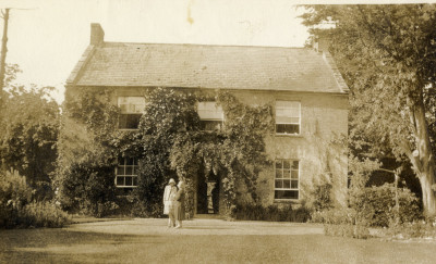 Two women on lawn in front of Thorney House