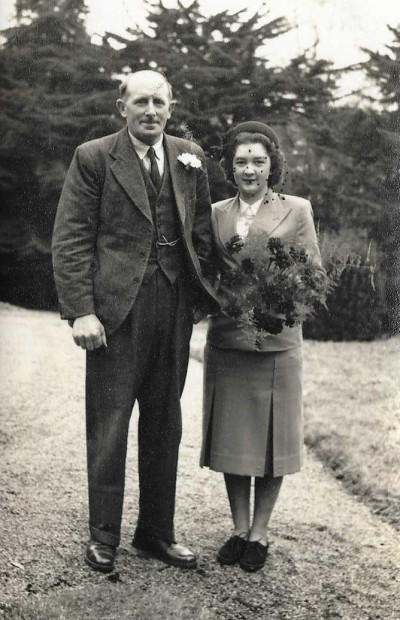 Man and woman holding flowers