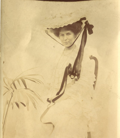 Woman in studio photo wearing very fine clothes